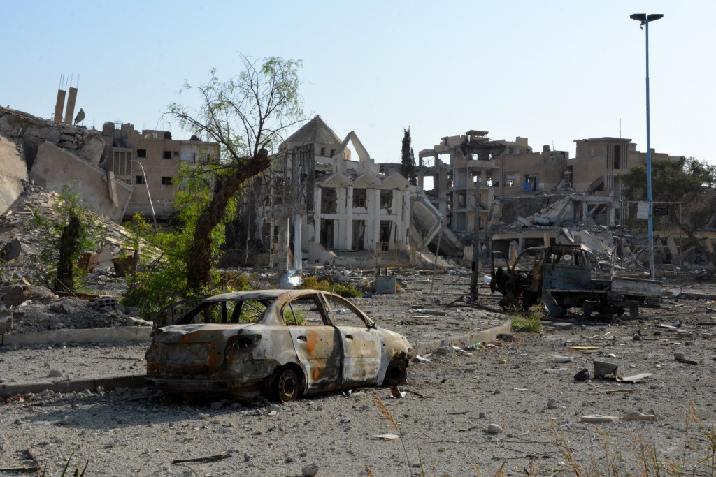 epa06284517 Damaged buildings and vehicles are seen after fighters from Syrian Democratic Forces (SDF) took control of Raqqa, Syria, 22 October 2017 (issued 23 October 2017). Media reports on 22 October said Russia accused the coalition of heavily bombing Raqqa in the fight against the IS. The US-backed Syrian Democratic Forces announced on 18 October they have seized the majority of the Syrian northeastern city of al-Raqqa concluding a campaign that began on 06 June to liberate the city, former capital of the caliphate self-proclaimed by the IS terror organization in 2014. EPA/YOUSSEF RABIH YOUSSEF