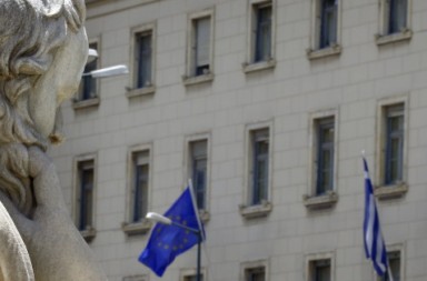 A statue of Greek philosopher Socrates is seen before the building of the Bank of Greece in Athens June 17, 2015.  The Greek central bank warned on Wednesday that the country would be put on a "painful course" towards default and exiting the euro zone if the government and its international creditors failed to reach an agreement on an aid-for-reforms deal.REUTERS/Yannis Behrakis